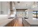 Contemporary kitchen with quartz countertops, modern appliances, and a view of the backyard at 3323 N 81St St, Mesa, AZ 85207