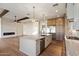 Open-concept kitchen with a large island, stainless steel appliances, and lots of cabinet space at 3323 N 81St St, Mesa, AZ 85207