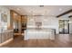 Modern, well-lit kitchen featuring white cabinetry, stainless steel appliances, and a central island at 3323 N 81St St, Mesa, AZ 85207