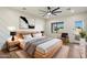 The main bedroom is spacious and airy with modern fixtures and a geometrically patterned accent wall at 3323 N 81St St, Mesa, AZ 85207