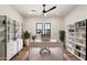 Bright office space featuring hardwood floors, modern desk, and built-in shelving at 3323 N 81St St, Mesa, AZ 85207