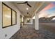 Covered back patio with gray pavers, white columns, and desert views at 3323 N 81St St, Mesa, AZ 85207