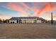 Expansive rear exterior featuring desert landscaping and modern architecture under a vibrant sunset sky at 3323 N 81St St, Mesa, AZ 85207
