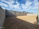 Large, spacious dirt backyard, providing ample space for landscaping and outdoor activities at 4151 W Lisa Ln, San Tan Valley, AZ 85144