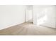 Neutrally decorated bedroom with a carpeted floor, closet and open doorway at 4151 W Lisa Ln, San Tan Valley, AZ 85144