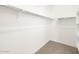 Walk-in closet includes ample shelving and a rack for optimal storage at 4151 W Lisa Ln, San Tan Valley, AZ 85144
