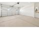 Spacious two car garage with clean, sealed concrete flooring and garage door with windows at 4151 W Lisa Ln, San Tan Valley, AZ 85144