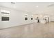 Spacious open-concept living area features large windows and tile flooring at 4151 W Lisa Ln, San Tan Valley, AZ 85144