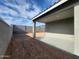 Covered patio and backyard space with block wall, ready for personalization and outdoor living at 4151 W Lisa Ln, San Tan Valley, AZ 85144