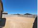 View of the backyard showcasing an undeveloped lot with block wall fencing at 4182 W Lisa Ln, San Tan Valley, AZ 85144