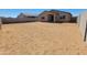 The home features a large undeveloped backyard with block wall fencing at 4182 W Lisa Ln, San Tan Valley, AZ 85144