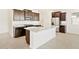 Modern kitchen features granite countertops, stainless steel appliances, and ample cabinet space at 4182 W Lisa Ln, San Tan Valley, AZ 85144