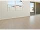 Bright living room with tile floors, windows and sliding glass door at 4182 W Lisa Ln, San Tan Valley, AZ 85144