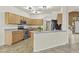 Well-lit kitchen with stainless steel appliances, ample cabinetry, and an open layout to adjacent spaces at 4712 E Amberwood Dr, Phoenix, AZ 85048
