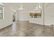 Spacious living room featuring tile flooring, large window and glass sliding doors offering ample natural light at 4712 E Amberwood Dr, Phoenix, AZ 85048