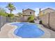Enjoy the privacy of this backyard pool with stone trim and green landscaping at 4712 E Amberwood Dr, Phoenix, AZ 85048