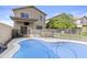 A refreshing swimming pool with safety fence offers a cool retreat and outdoor enjoyment at 4712 E Amberwood Dr, Phoenix, AZ 85048