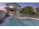 This spacious backyard offers a beautiful pool to cool off from the Arizona heat at 4712 E Amberwood Dr, Phoenix, AZ 85048