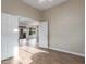 Bright bedroom with wood floors, open doorway, and neutral paint at 5381 S Emerald Desert Dr, Gold Canyon, AZ 85118