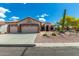 Charming single-story home with a three-car garage and desert landscaping at 5381 S Emerald Desert Dr, Gold Canyon, AZ 85118