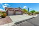 Charming single-story home with a three-car garage, long driveway and desert landscaping at 5381 S Emerald Desert Dr, Gold Canyon, AZ 85118