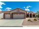 Charming single-story home with a three-car garage and desert landscaping at 5381 S Emerald Desert Dr, Gold Canyon, AZ 85118