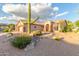 Charming single-story home with desert landscaping, featuring a large saguaro cactus and stone accents at 5381 S Emerald Desert Dr, Gold Canyon, AZ 85118