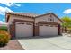 Three-car garage with decorative details at 5381 S Emerald Desert Dr, Gold Canyon, AZ 85118