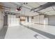 Spacious garage features ample cabinet storage, overhead rack, epoxy floors, and garage door opener at 5381 S Emerald Desert Dr, Gold Canyon, AZ 85118