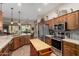 Spacious kitchen with stainless steel appliances, an island, and wood cabinets at 5381 S Emerald Desert Dr, Gold Canyon, AZ 85118