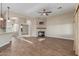 Bright and airy living room with wood floors, a stone fireplace, and an open layout at 5381 S Emerald Desert Dr, Gold Canyon, AZ 85118