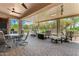 Large covered patio with ceiling fans and comfortable seating for entertaining at 5381 S Emerald Desert Dr, Gold Canyon, AZ 85118