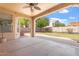 Covered patio perfect for outdoor living with a ceiling fan, brick trim, and view of the backyard at 5408 W Allen St, Laveen, AZ 85339