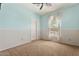 Carpeted bedroom with two-tone walls and a window providing natural light at 5408 W Allen St, Laveen, AZ 85339