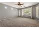 Large bedroom with natural light and neutral carpeting at 5408 W Allen St, Laveen, AZ 85339