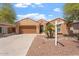 Charming single-story home featuring a two-car garage, desert landscaping, and a 'coming soon' sign at 5408 W Allen St, Laveen, AZ 85339