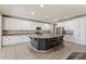 Bright eat-in kitchen with white cabinets, stainless appliances, and granite countertops at 5408 W Allen St, Laveen, AZ 85339