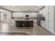 Bright eat-in kitchen with white cabinets, stainless appliances, and granite countertops at 5408 W Allen St, Laveen, AZ 85339