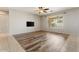 Open-concept living room featuring luxury vinyl flooring and a ceiling fan at 5408 W Allen St, Laveen, AZ 85339
