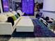 Comfortable living room features a plush white sofa with accent pillows and a cozy rug at 7162 W Lone Cactus Dr, Glendale, AZ 85308