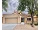 View of front home exterior showing the driveway, garage, and decorative breezeway at 8863 S Grandview Dr, Tempe, AZ 85284