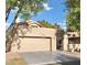 Tan home with a two car garage, a tile roof, and minimal landscaping at 8863 S Grandview Dr, Tempe, AZ 85284