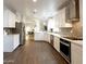 Kitchen with white cabinets, stainless steel appliances, and wood-look floors at 8863 S Grandview Dr, Tempe, AZ 85284