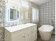 Bathroom with a vanity, standalone tub, and patterned wallpaper at 8863 S Grandview Dr, Tempe, AZ 85284