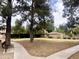 Community park with mature trees, walking paths, and a covered area for relaxation at 8863 S Grandview Dr, Tempe, AZ 85284