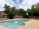 Community swimming pool featuring clear water, multiple lounge chairs, and lush landscaping at 8863 S Grandview Dr, Tempe, AZ 85284