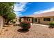 Private backyard features a cozy gazebo and desert landscaping with a view of the home's exterior at 9154 E Caribbean Ln, Scottsdale, AZ 85260