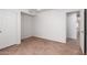 A bright bedroom with tile floors and a closet with sliding doors at 9154 E Caribbean Ln, Scottsdale, AZ 85260