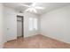 Bedroom with tile floors, closet, and a window with vertical blinds at 9154 E Caribbean Ln, Scottsdale, AZ 85260