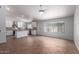 Open concept kitchen with a center island, white cabinetry, and stainless steel appliances, seamlessly connecting to living area at 9154 E Caribbean Ln, Scottsdale, AZ 85260
